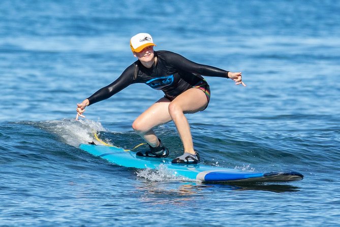2 Hour Beginner Group Surf Lessons - Paddling out and taking your first wave