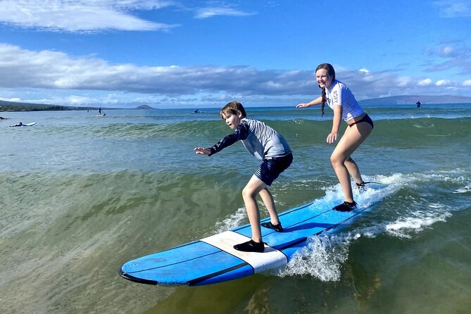 Group Surf Lesson at Kalama Beach in Kihei - Catching your first waves in warm, shallow water