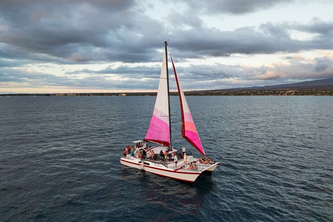 Sunset Sailing on a Floating Tiki Bar Charming Hawaiian Catamaran - Weather, group size, and cancellation details
