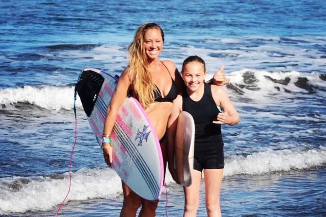 Waves Hawaii Surf School in Kihei Maui - Getting fitted with a rash guard, reef shoes, and board